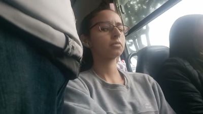 Young Brazilian woman with glasses rests on a bus while being subtly observed - yesvids.com - Brazil