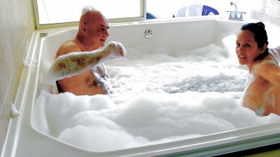 Slovakian woman and older man share a foamy nude bath in sunlit bathroom - yesvids.com